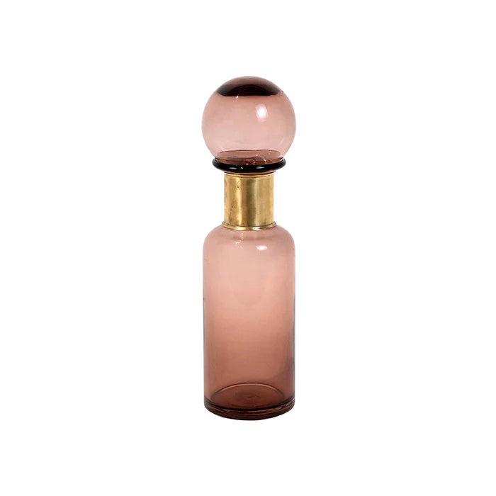 retro plum coloured glass bottle with round lid and gold neck