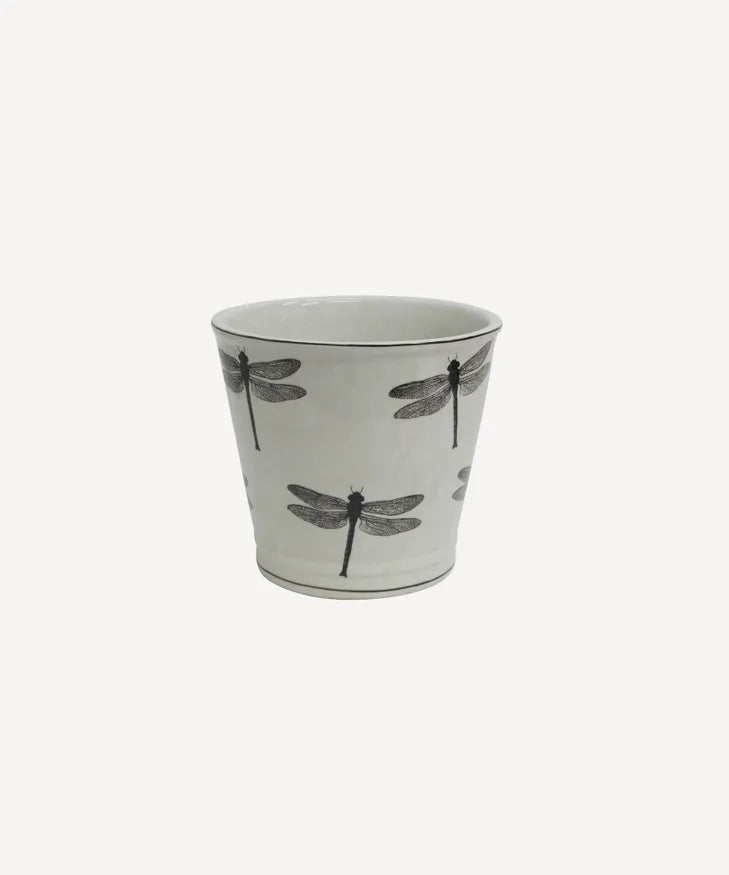 Ceramic planter with black dragonfly design on a light gray background