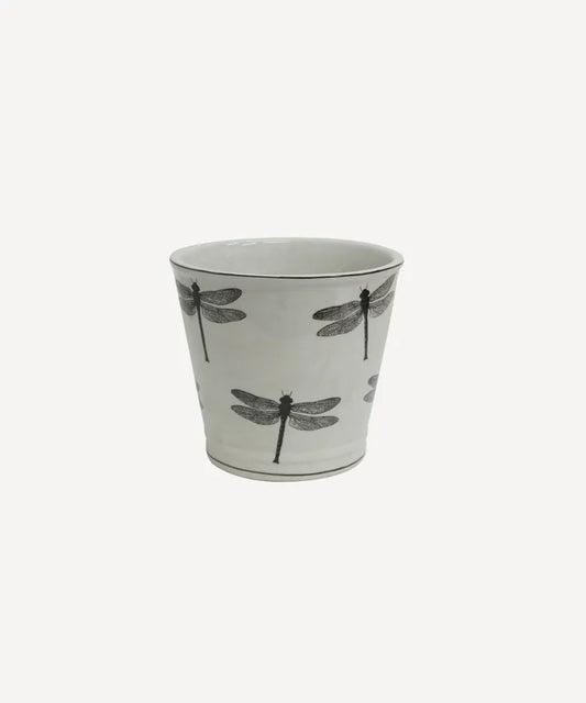 Ceramic planter with black dragonfly design on a light gray background