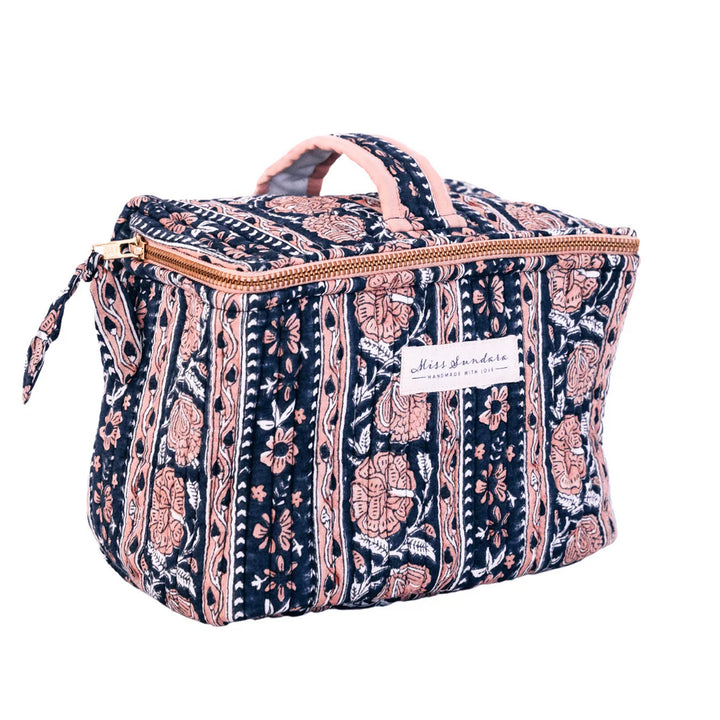 Marsala vanity bag. Block printed  Bronze gold Metal zip Zipper adorned with printed bow Plasticized waterproof lining Two inner compartments