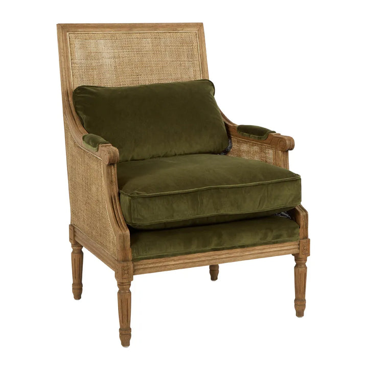 Carved oak armchair with olive green cotton velour and ratan back