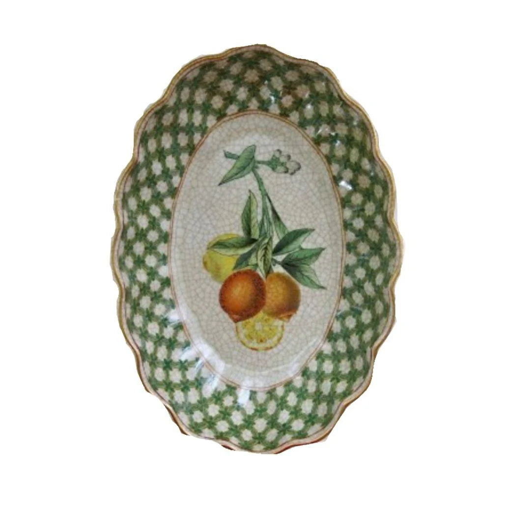 Decorative plate with fruit design on a green and white checkered background