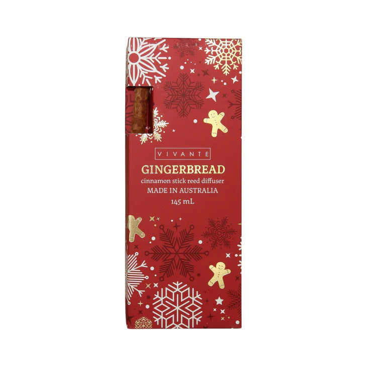 Red gingerbread-themed diffuser packaging with snowflakes and gingerbread men on a white background.