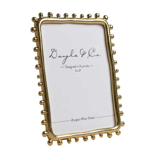 gold frame with dotted feature around frame, fits 4x6 picture