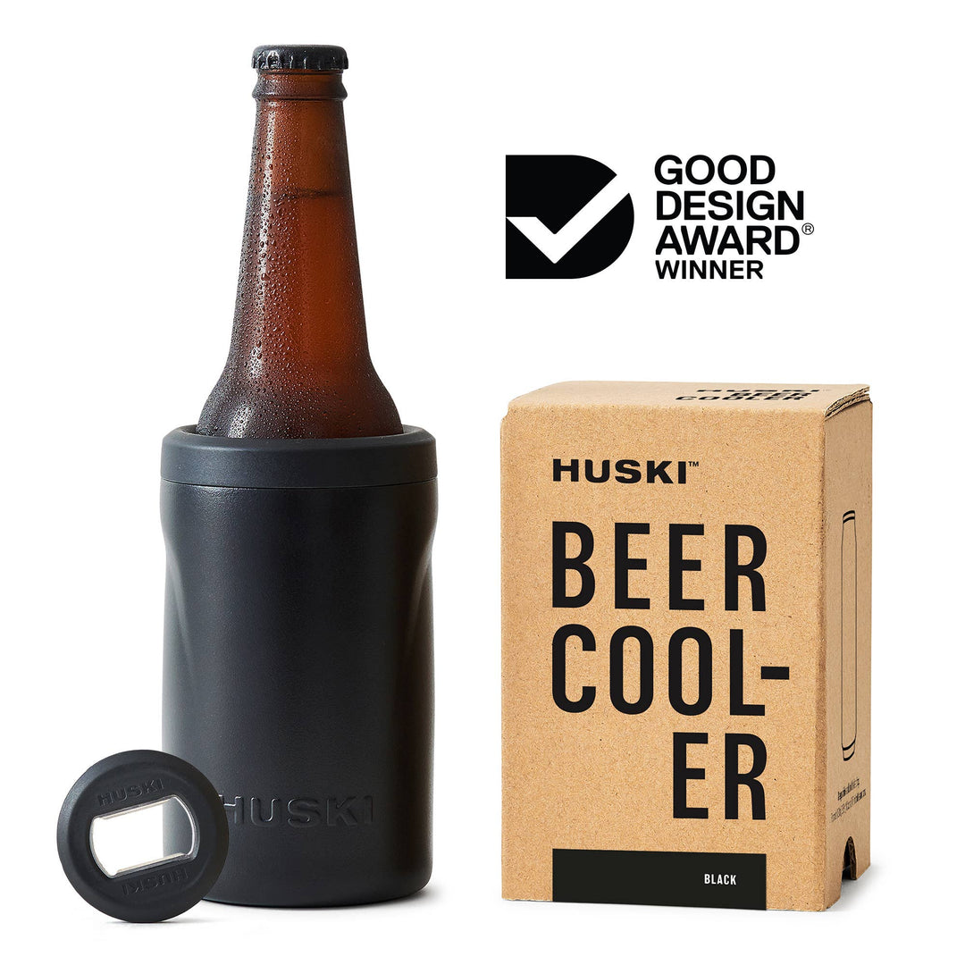 Huski beer cooler with bottle, box, and bottle opener on a white background