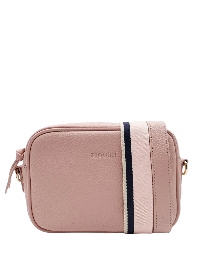 Pink crossbody bag with a black strap on a white background
