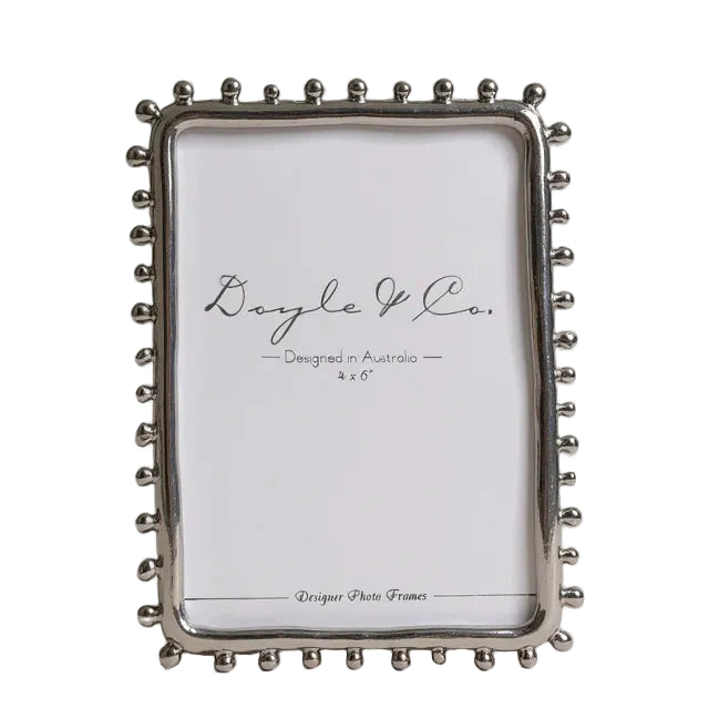 silver picture frame with dotted feature edge