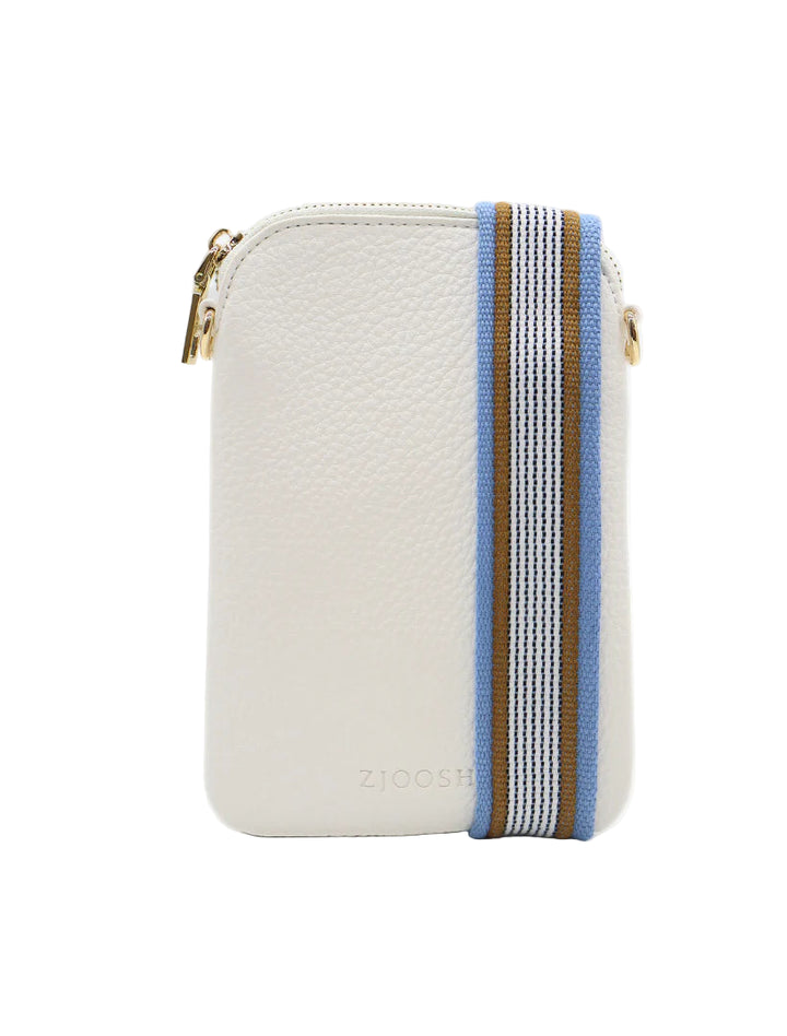 A white crossbody bag with a brown and blue striped webbing strap, featuring a zipper closure and a gold-tone hardware tag.