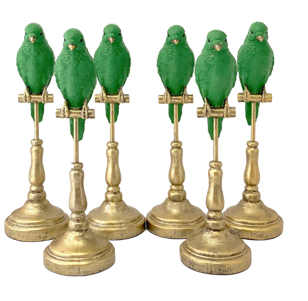 Green parrot on gold stand